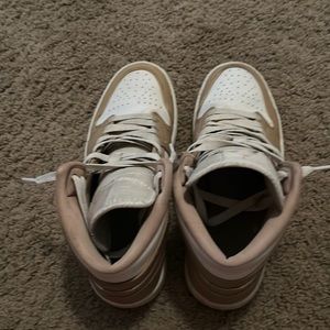 Tan and white Jordan 1 mid